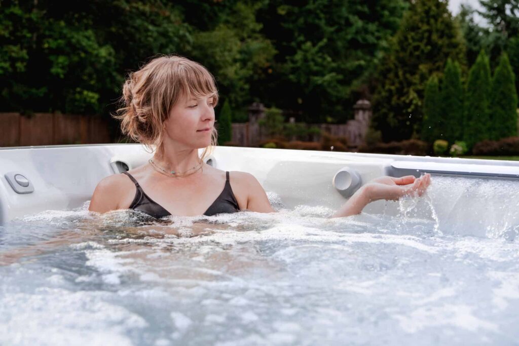 Hot Tub Vs Swim Spa: Which One Is Right For Your Backyard? - Premium Home Leisure Uncategorized Jht J508L Platinum Flax Seattle Woman Waterfall - Premium Home Leisure